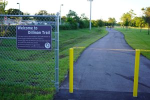 Image of the 2023 Dillman Trail in Greenacres showing a paved pathway with grass on either side